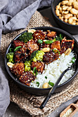 Sticky sesame tofu with sweet and sour sauce and rice