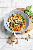 Pumpkin-millet dish with spinach and feta cheese