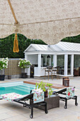 Two sun loungers and coffee table by the pool