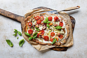 Tarte flambée with seafood and tomatoes