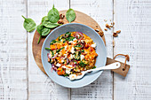 Pumpkin-millet dish with spinach and feta