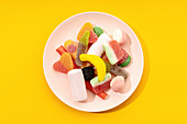 Multicolored gummy candies on plate
