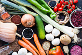 Organic vegetables and grains in bowls and jars