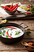 Coconut milk with chillies and Asian herbs