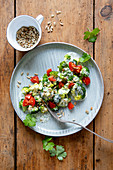 Broccoli salad with cherry tomatoes and sunflower seeds