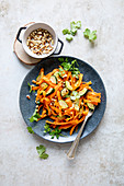 Carrot tagliatelle with roasted pine nuts