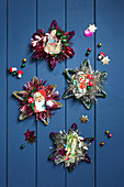 Arrangement of vintage-style stars made from pipe cleaners and shiny scrapbook pictures