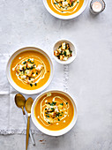 Creamy carrot soup with garlicky seeded croutons