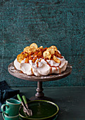 Baked apple pavlova with apple chips and caramel