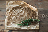 Parchment paper and fresh rosemary