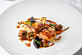 Braised quail with figs and roasted root vegetables