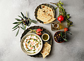 Iranian labneh with taftan bread and pomegranate