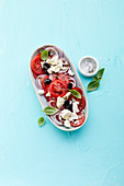 Tomato salad with red onions, black olives and feta cheese
