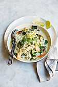 Thai coconut soup with rice noodles and cashew nuts