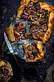 Fig tart in phyllo crust with blue camembert cheese, crispy sage and chopped nuts