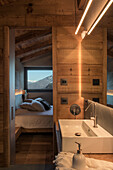 Ensuite bathroom with countertop basin and view into bedroom