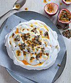 Pavlova with yogurt, passion fruit and sesame