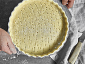 Vegan shortcrust pastry in a baking pan