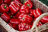 Red peppers in a basket on a market stall