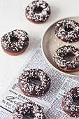 Donuts with chocolate glaze and coconut shreds