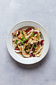 Duck breast salad with red pears and nuts