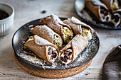 Cannoli with ricotta filling, pistachios and chocolate chips
