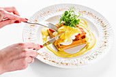 Toast with poached egg, salmon and mustard sauce