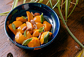 Roasted Peaches with almonds and mint