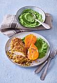 Chicken breast in almond-pistachio cover with sweet potatoes and broccoli puree