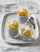 Chia pudding with mago and coconut flakes
