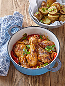 Chicken drumsticks with tomatoes and pepper