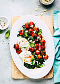 Poached egg with spinach and oven-roasted tomatoes