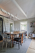 Wooden dining table with chairs, ladder to the lofted sleeping area