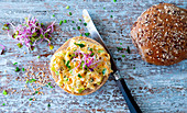 Coleslaw with radish shoots on a wholemeal roll
