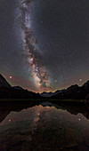 Milky Way, Mars and Jupiter over a mountain lake
