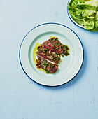 Beef steak with chilli, capers and parsley oil