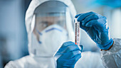 Scientist holding a test tube in a laboratory