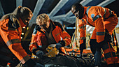 Team of paramedics providing medical help