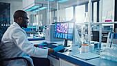 Scientist using a computer in a laboratory