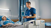 Nurse talking to patient on hospital ward