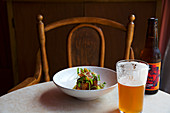 Pork vindaloo served with beer