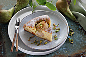 A piece of yoghurt cake with whole pear