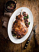 Leg of lamb with pomegranate and balsamic onions
