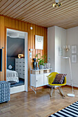 Classic rocking chair and floor lamp in the corner of room