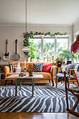 Rug with zebra-skin pattern and yellow sofa in living room