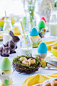 Dyed easter eggs on colourful easter table