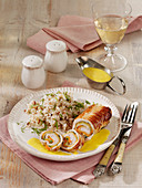 Stuffed turkey roulade with pepper sauce and rice