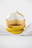 Lemon Meringue pie on top of sliced lemons