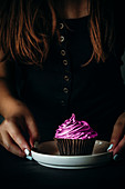 Chocolate cupcake with pink frosting