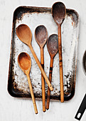 Wooden spoons on a vintage baking sheet
